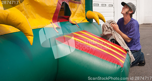 Image of Man Cleans Party Place Equipment Rental Fun Bouncy Balloon