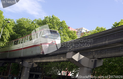 Image of Seattle Monorail Transit Train Travels Over Neighborhood Retro S