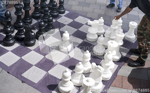 Image of Man Moves Piece People Playing Giant Chess Game Sidewalk Downtow