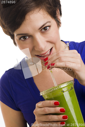 Image of Woman sips Green Smoothie