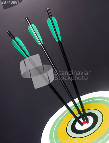 Image of Three Green Black Archery Arrows Hit Round Target Bullseye Cente