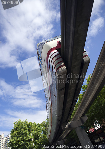 Image of Monorail Transit Train Travels Over Neighborhood Carrying People