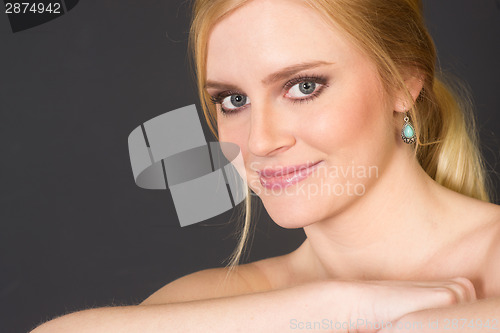 Image of Beautiful Blond Smiling Big in Head and Shoulders Beauty Pose