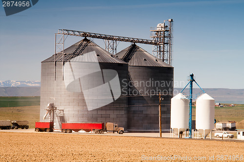 Image of Agricultural Silo Loads Semi Truck With Farm Grown Food Grain