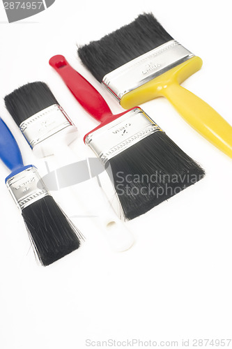 Image of Colorful Tools for Creating Paint Brushes Lay Together on White