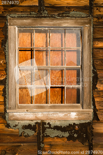 Image of Run Down Ruin Boarded Up House Plywood Window Panes