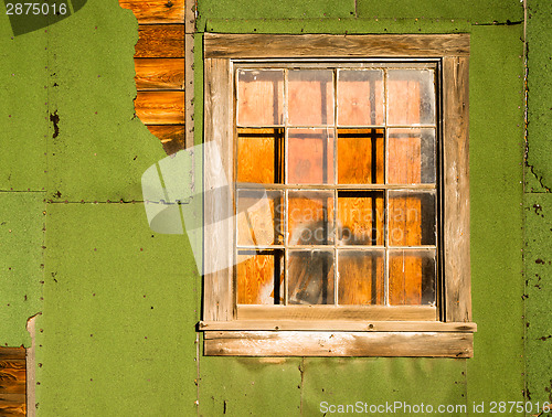 Image of Run Down Ruin Boarded Up House Plywood Window Panes