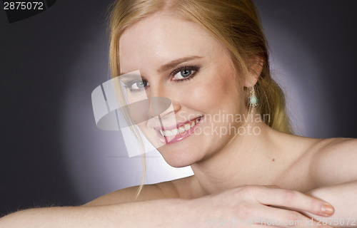 Image of Beautiful Blond Smiling Big in Head and Shoulders Beauty Pose