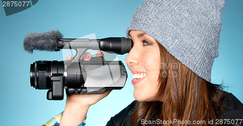 Image of Hip Young Adult Female Points Video Camera