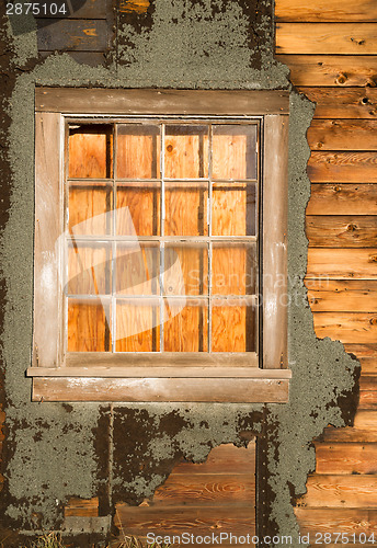 Image of Run Down Ruin Boarded Up House Plywood Window Panes