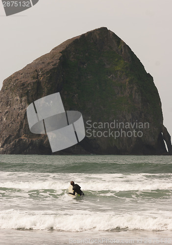 Image of Surfer Tries Catching Small Wave Rocky Butte Pacific Ocean 