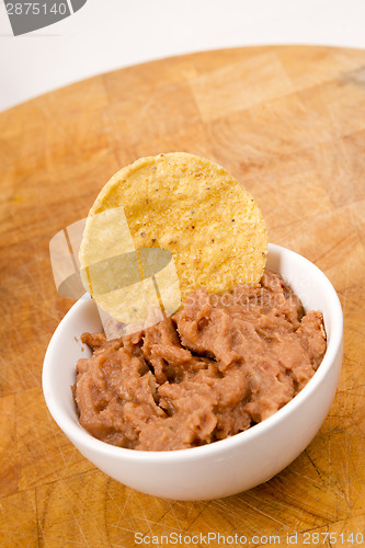 Image of Corn Chip Buried in Refried Beans Dish Snack Appetizer