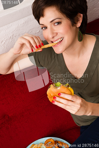 Image of Happy Healthy Young Adult Woman Eats Fast Food Cheesburger Lunch