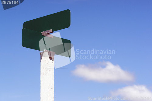 Image of Blank Signs Crossraods Street Avenue Sign Blue Skies Clouds