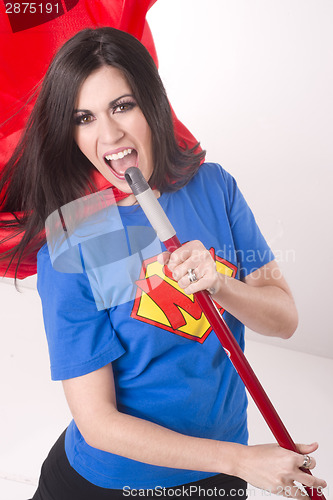 Image of Super Mom Singing Kareoke with Broom Stick