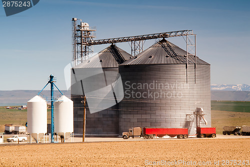 Image of Agricultural Silo Loads Semi Truck With Farm Grown Food Grain