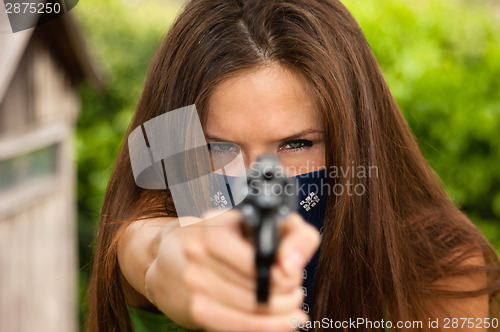 Image of Female Bandit Points Snub Nose Revolver Handgun Weapon