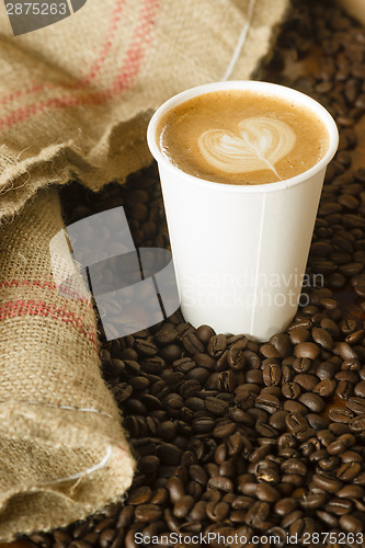 Image of Cappuccino To Go Paper Cup Burlap Bag Roasted Coffee Beans