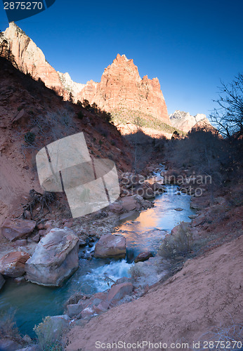 Image of River Flows Sunrise Glow Rocky Butte Zion National Park