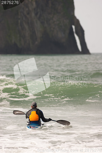 Image of Man Paddles into Ocean Surf Riding Sea Kayak Boat Sport