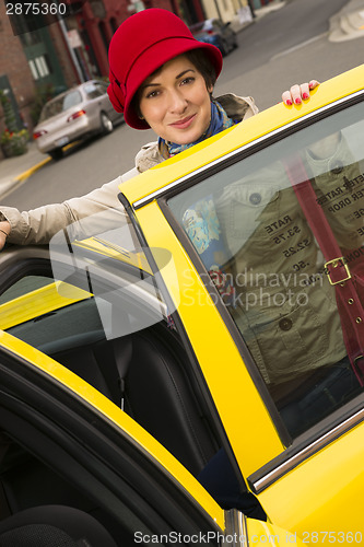 Image of Woman Smiling Wearing Bright Accents Enters Taxi Cab Automobile 