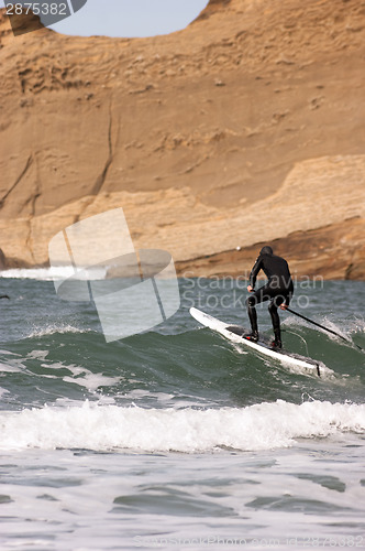 Image of Man Black Wetsuit Ocean Surf Riding Paddle Board Summer Sport