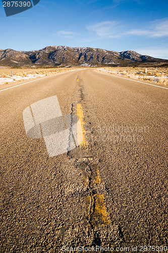 Image of Blue Sky Worn Mountain Road Desert Travel Asphalt