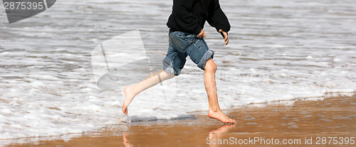 Image of Young Boy Running Feet Ocean Beach Surf Crashing Sea Foam