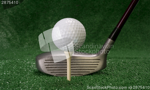 Image of Driver Sitting in Front of Teed Up Golf Ball