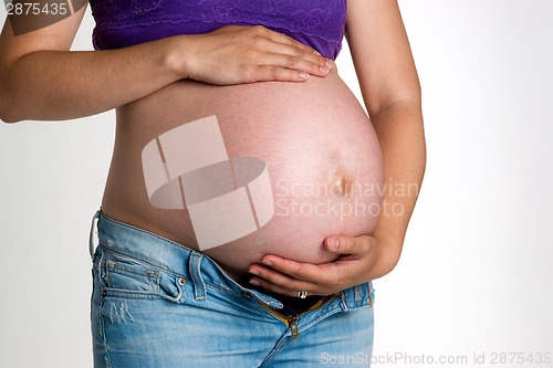 Image of Pregnant Woman Expecting Baby Torso Standing Hands on Belly