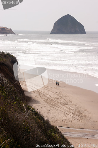 Image of Couple Walks Blustery Day Bluffs Seaside Oregon Coast Pacific Oc