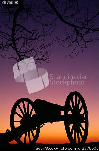 Image of War Memorial Wheeled Cannon Military Civil War Weapon Dusk Sunse