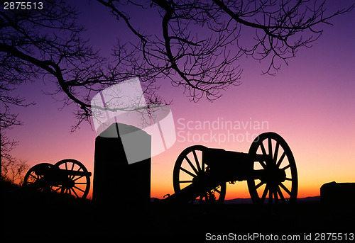 Image of War Memorial Wheeled Cannon Military Civil War Weapon Dusk Sunse