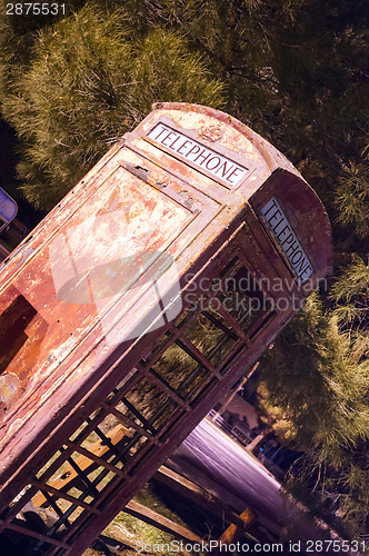 Image of Skewed Vintage Obsolete Outdoor Telephone Booth Southwest Rural 