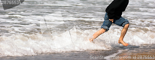 Image of Young Boy Running Feet Ocean Beach Surf Crashing Sea Foam