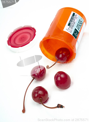 Image of Food Cherries Roll out of Pharmacy Medicine Container