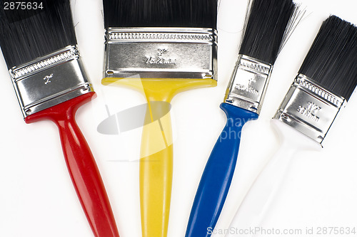 Image of Colorful Tools for Creating Paint Brushes Lay Together on White