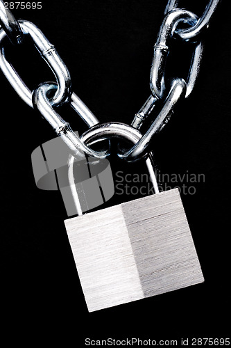 Image of Link Chain Connected By Keyed Steel Locking Padlock on Black