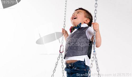 Image of Happy Young Boy Plays Swing Suspended Moving Laughing Child Play