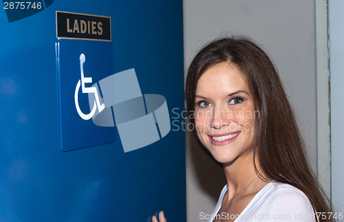 Image of Attractive Woman Enters Ladies Bathroom Women's Handicapped Lava