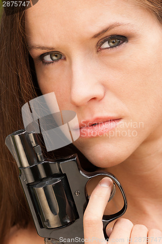 Image of Pretty Woman Angry Looking Female Holds Pistol Revolver Handgun 