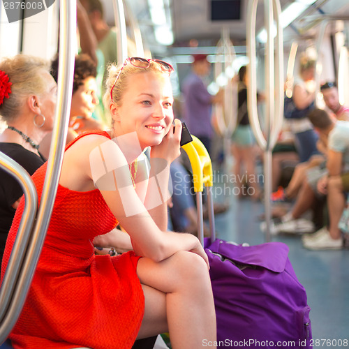 Image of Lady traveling by metro.