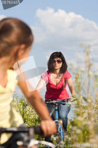 Image of Mother and daughter cycling