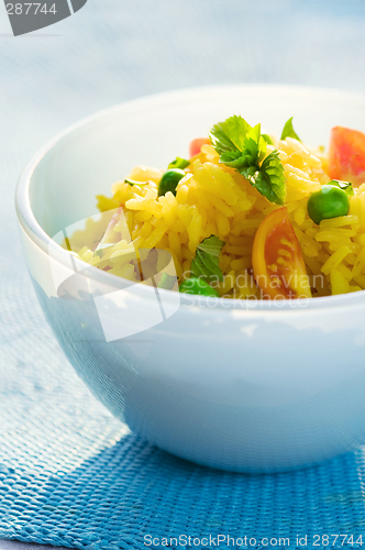 Image of saffron (or curry) rice and vegetable salad