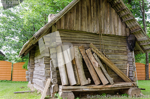 Image of old  ancient rustic log house 