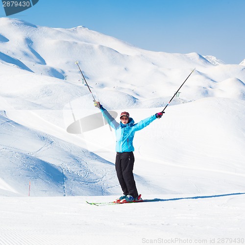 Image of Excited woman skier.