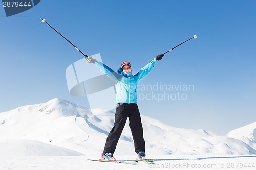 Image of Excited woman skier.