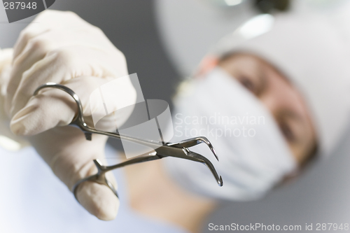 Image of Doctor with forceps