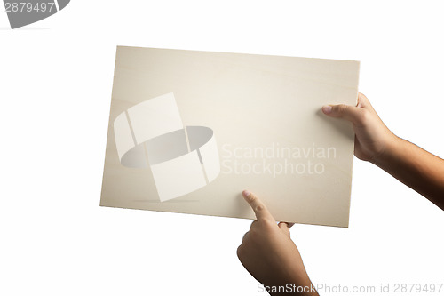 Image of Plywood sign held up by young hands