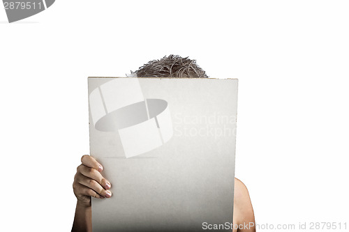 Image of White Plastic laminate sign held up by hands